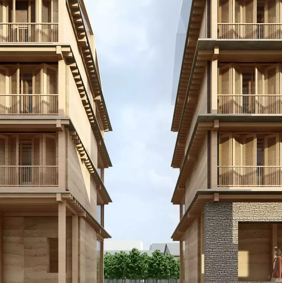 Façade du bâtiment, avec en arrière-plan une production alimentaire.