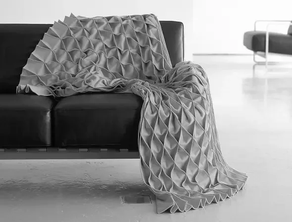 Das Fassadengeflecht soll mit der textilen Haptik assozieren.