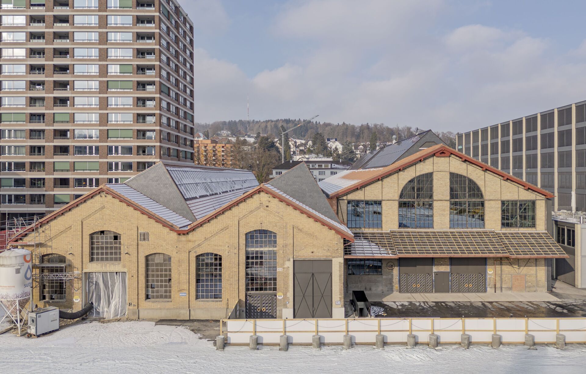 Les façades en brique de l’ancienne halle SLM ont été traitées avec beaucoup de respect pour l’existant. | Foto: René und Dimitri Dürr Les façades en brique de l’ancienne halle SLM ont été traitées avec beaucoup de respect pour l’existant. | Foto: René und Dimitri Dürr